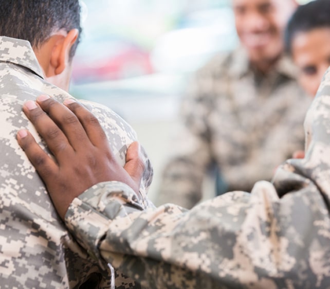 Veteran receiving support during a counseling session, highlighting trust and care for military service members.
